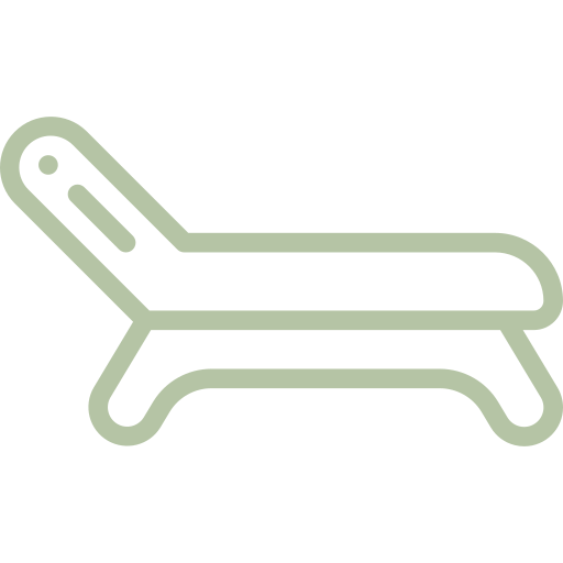 Minimalist icon of a lounge chair in green outline.